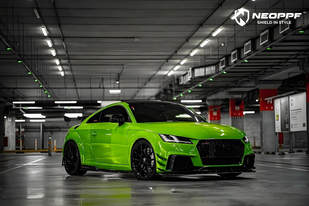 A sports car with Viper Green paint protection film colored wrap is parking in the garage