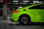 A sports car with Viper Green paint protection film colored wrap is parking in the garage