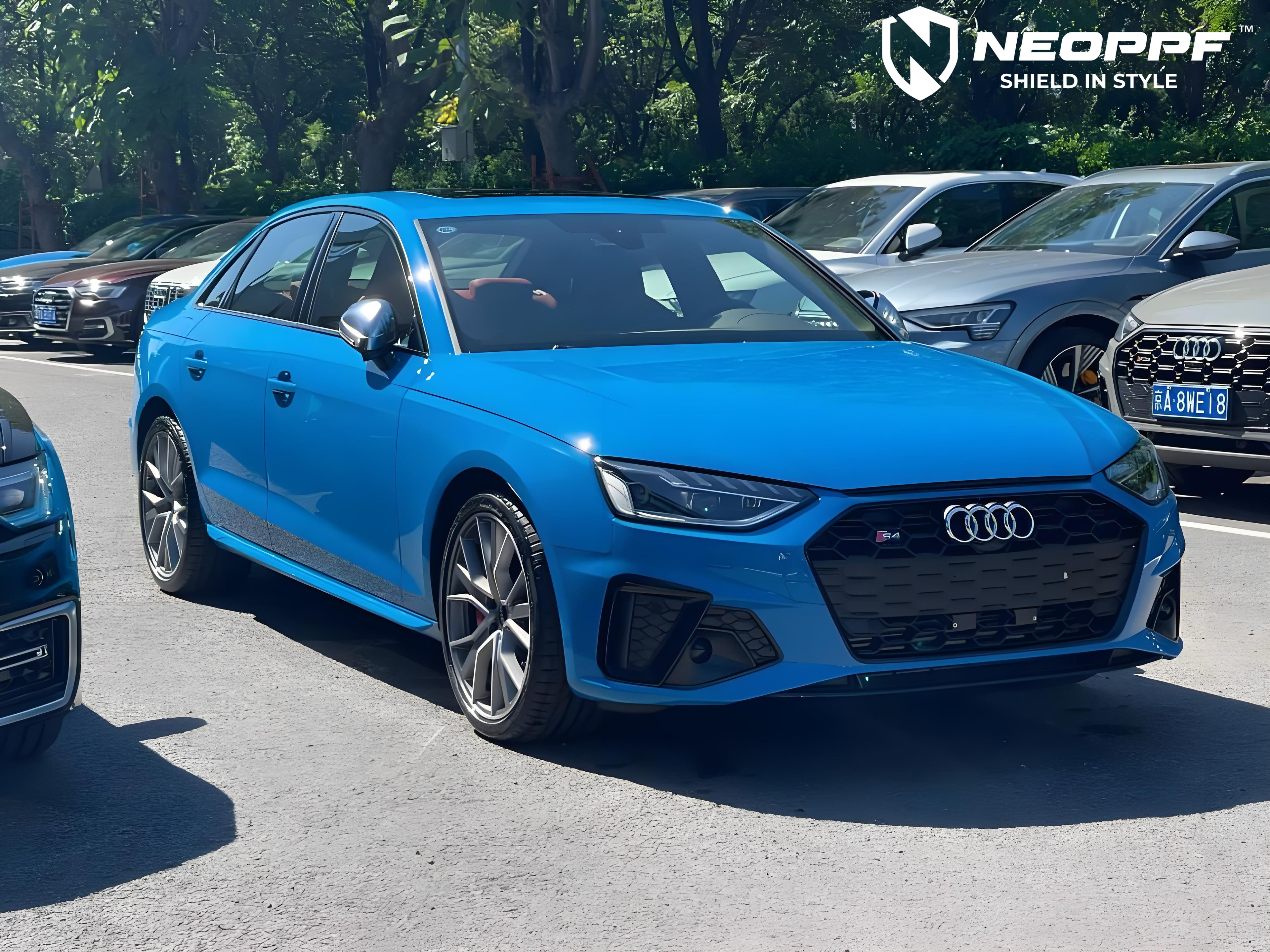 A sports car with Flowing Blue paint protection film colored wrap is parking in the garage