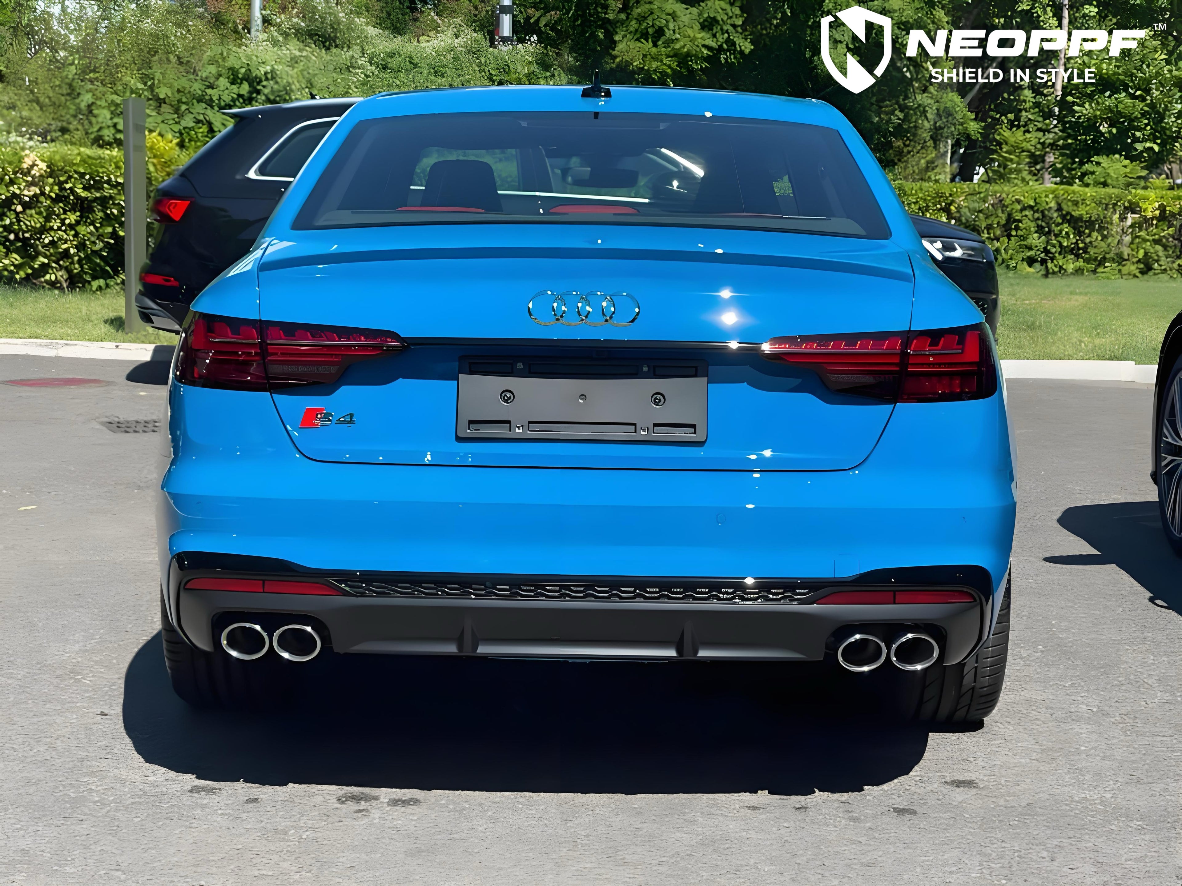 A sports car with Flowing Blue paint protection film colored wrap is parking in the garage