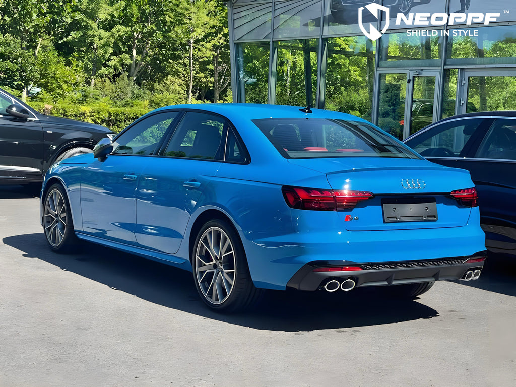 A sports car with Flowing Blue paint protection film colored wrap is parking in the garage