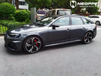 A sports car with Far Peak Gray paint protection film colored wrap is parking in the garage