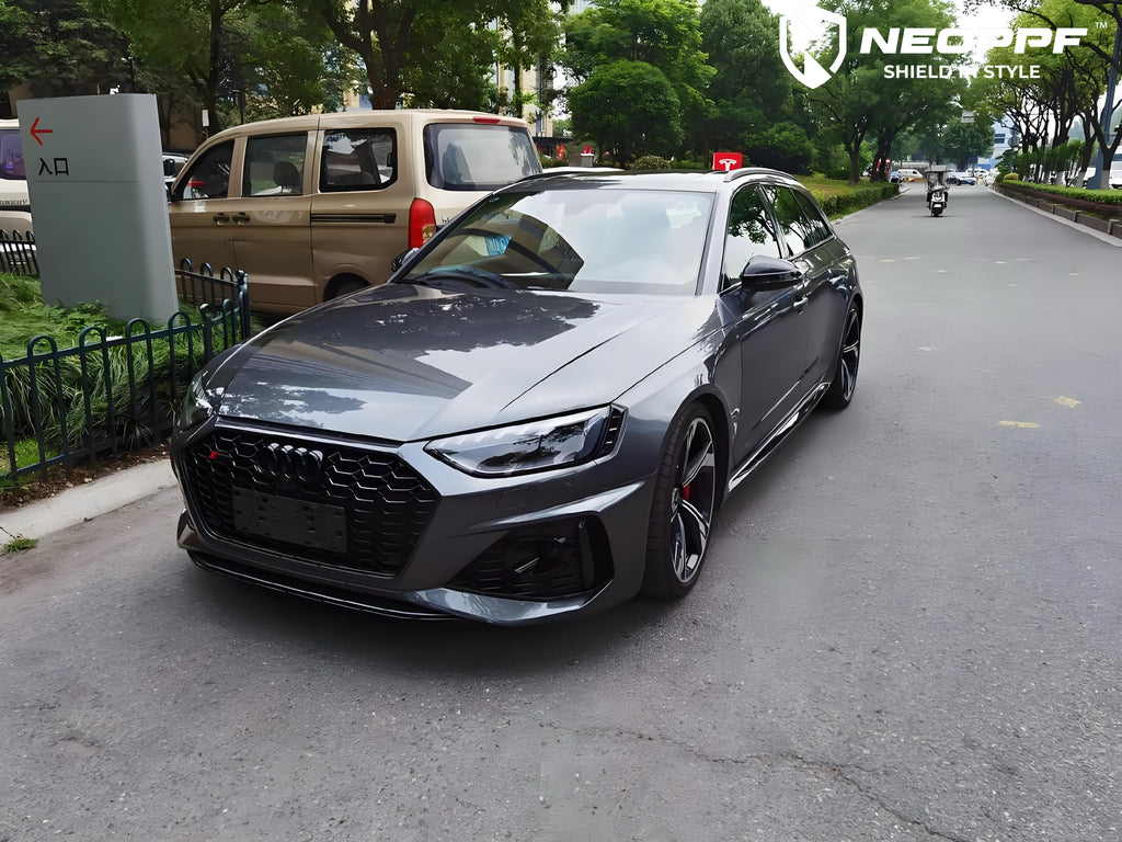 A sports car with Far Peak Gray paint protection film colored wrap is parking in the garage