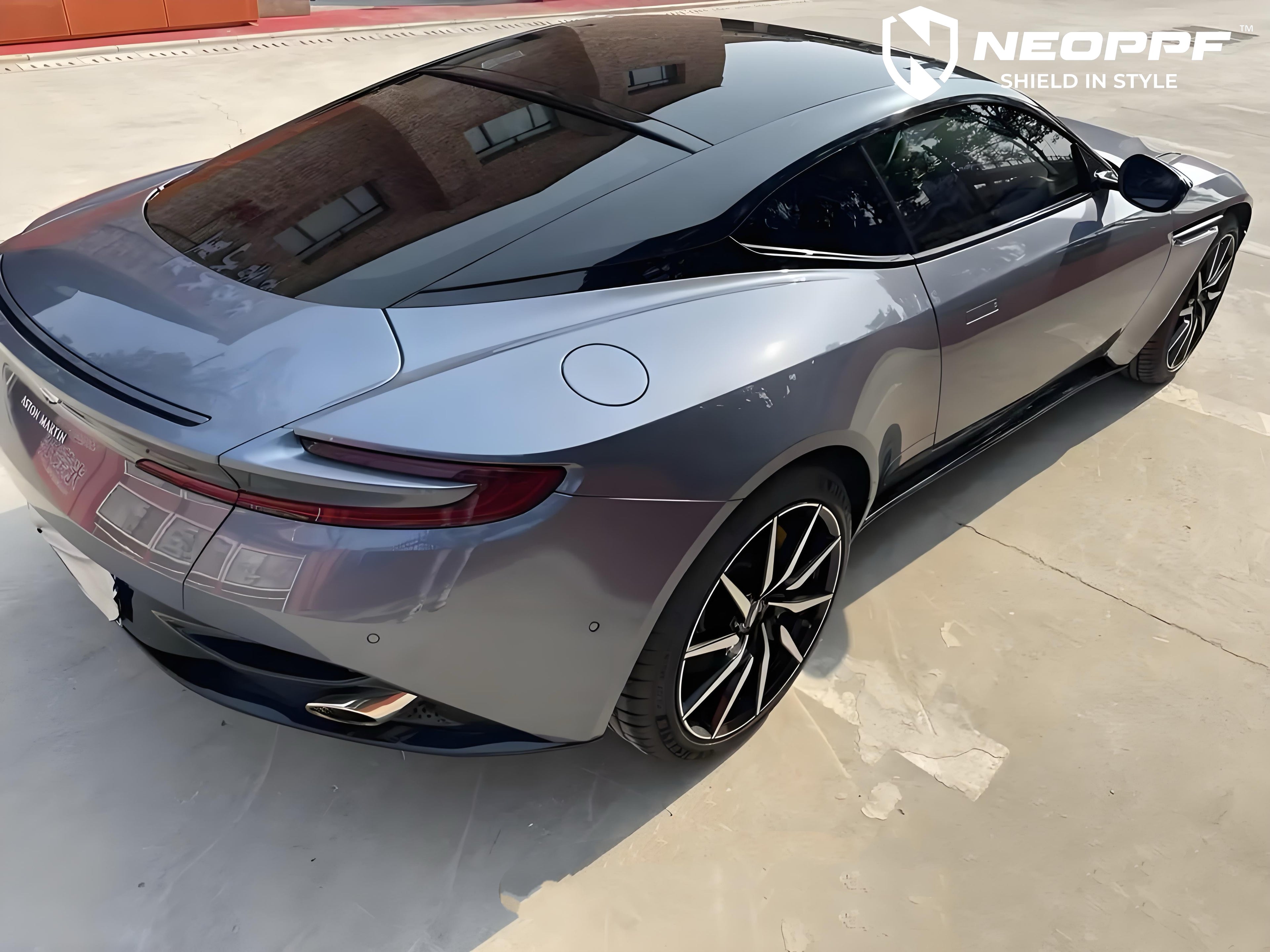 A sports car with Shark Blue paint protection film colored wrap is parking in the garage
