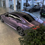 A sports car with Grayish Violet paint protection film colored wrap is parking in the garage