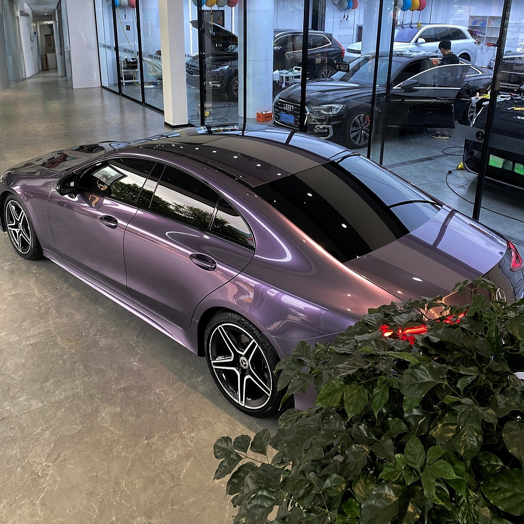 A sports car with Grayish Violet paint protection film colored wrap is parking in the garage