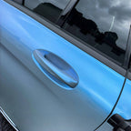 A sports car with Rock Gray paint protection film colored wrap is parking in the garage