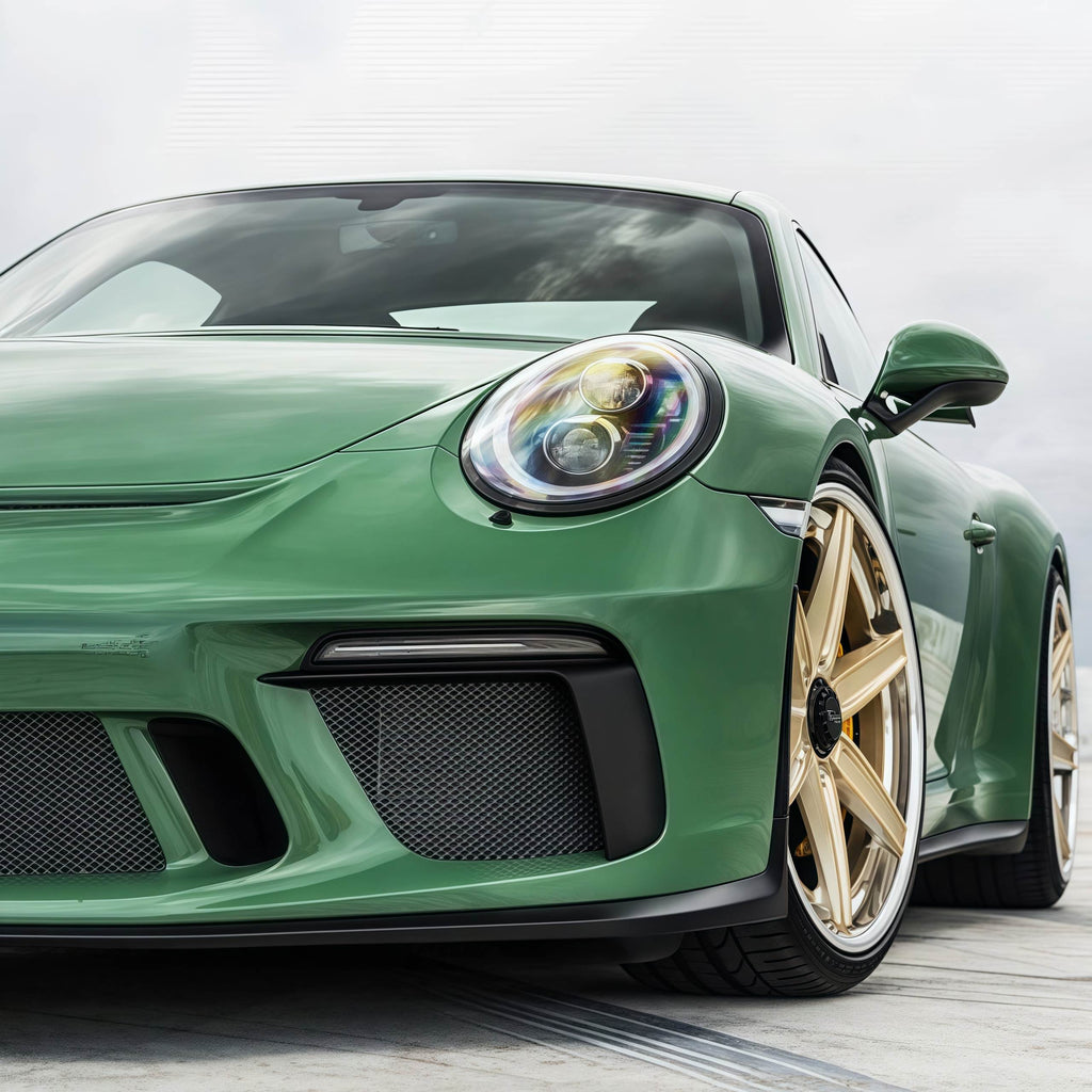 A sports car with Onium Green paint protection film colored wrap is parking in the garage