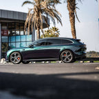 A sports car with Diamond Aurora Green paint protection film colored wrap is parking in the garage
