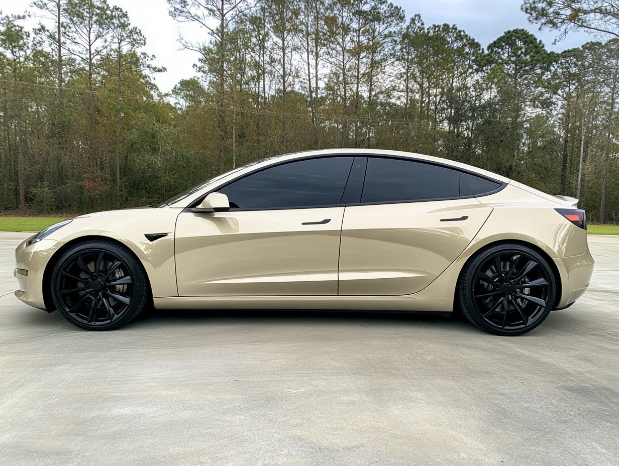 A sports car with Champagne Gold paint protection film colored wrap is parking in the garage