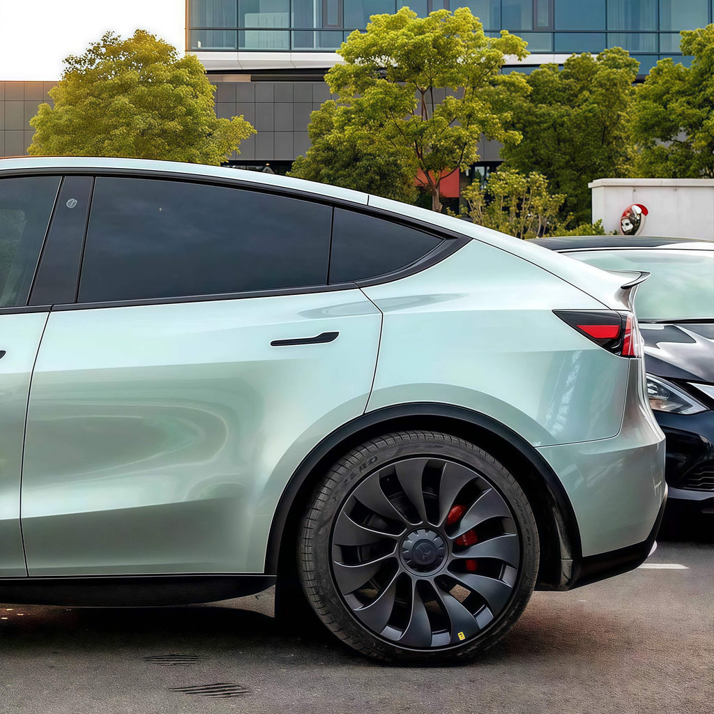 A sports car with Hardlin Green paint protection film colored wrap is parking in the garage