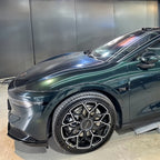 A sports car with Sand Green paint protection film colored wrap is parking in the garage