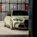 A sports car with Armoured Green paint protection film colored wrap is parking in the garage