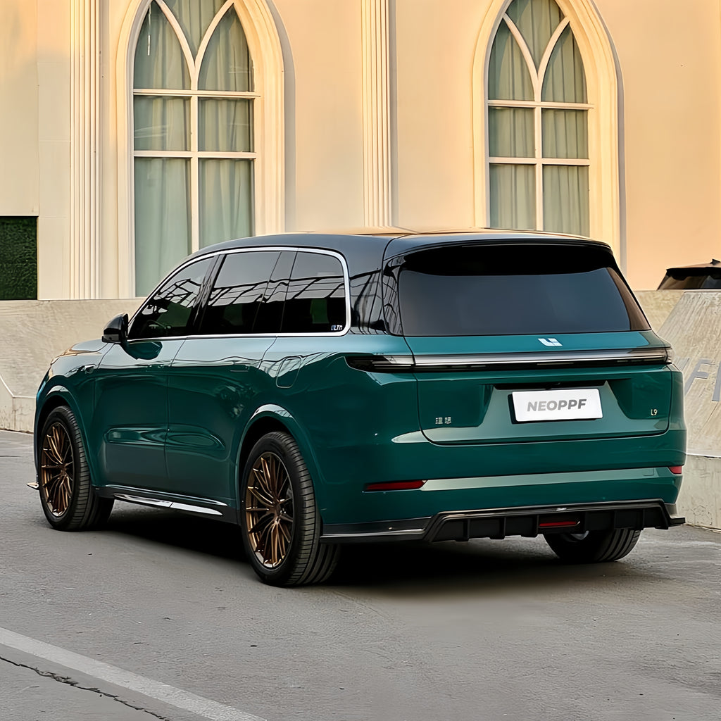A sports car with Green Hell paint protection film colored wrap is parking in the garage