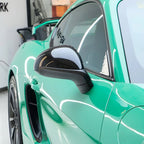A sports car with Retro Green paint protection film colored wrap is parking in the garage