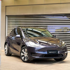 A sports car with Carbon Grayish Blue paint protection film colored wrap is parking in the garage