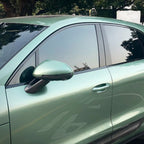 A sports car with Francesca Green paint protection film colored wrap is parking in the garage