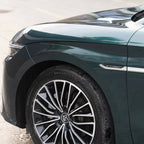 A sports car with Verdant Green paint protection film colored wrap is parking in the garage