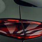 A sports car with Matte Mysterious Green paint protection film colored wrap is parking in the garage