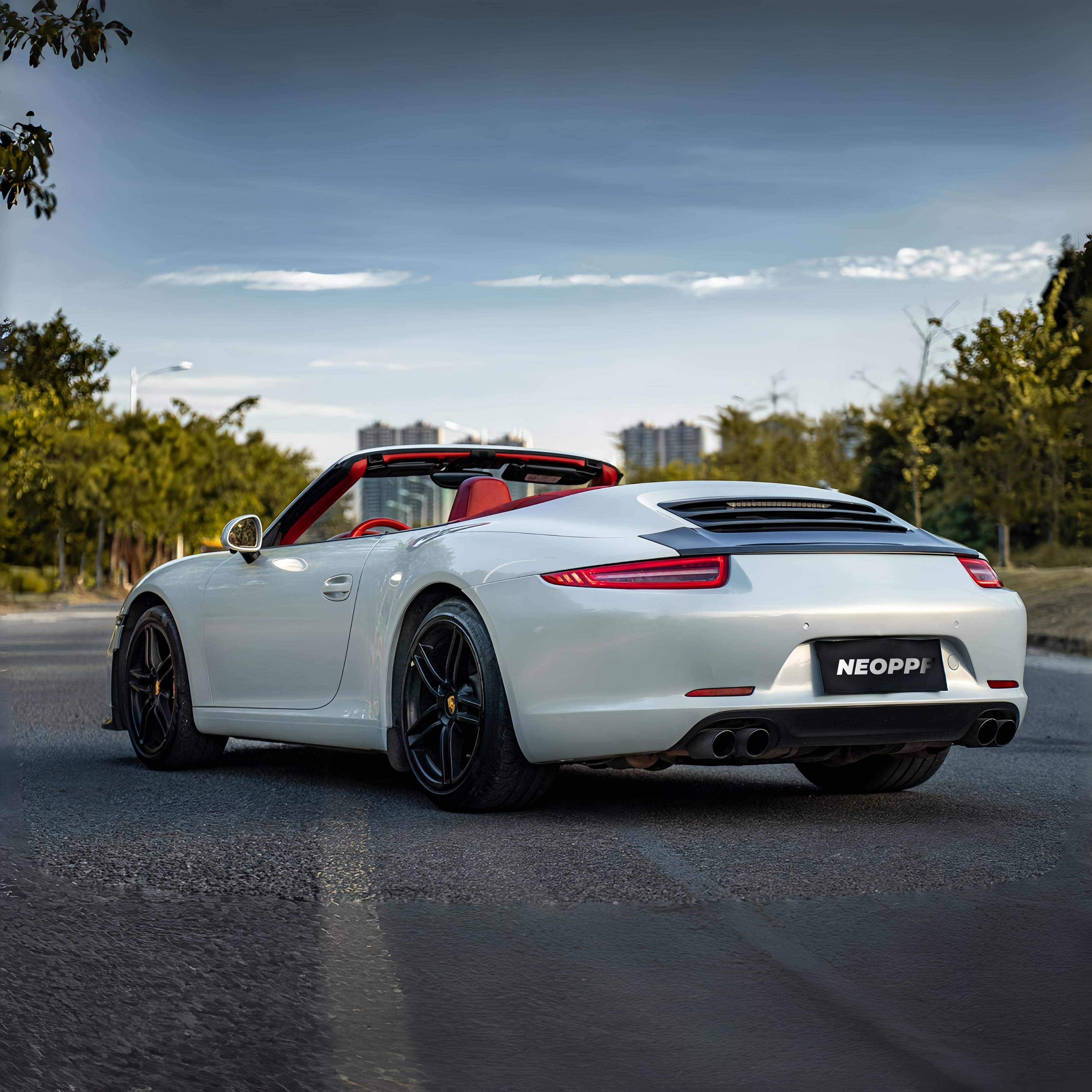 A sports car with Silver Fox Gray paint protection film colored wrap is parking in the garage