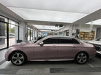 A sports car with Iced Berry Pink paint protection film colored wrap is parking in the garage