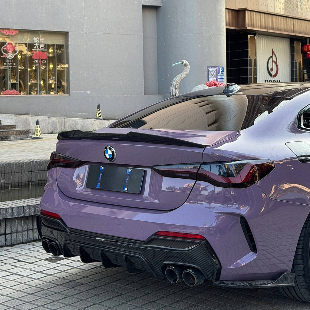 A sports car with Provence Purple paint protection film colored wrap is parking in the garage