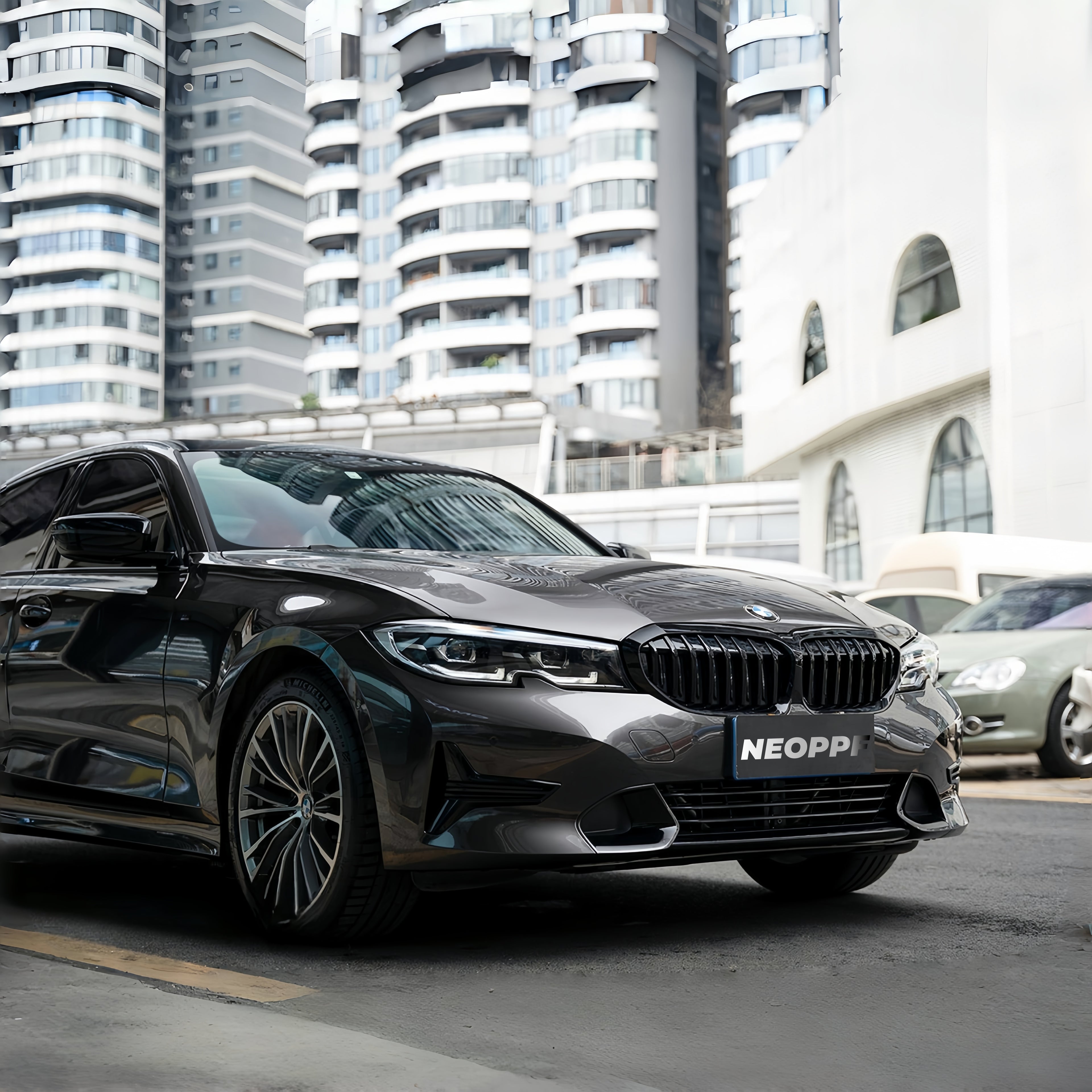 A sports car with Tungsten Metallic paint protection film colored wrap is parking in the garage