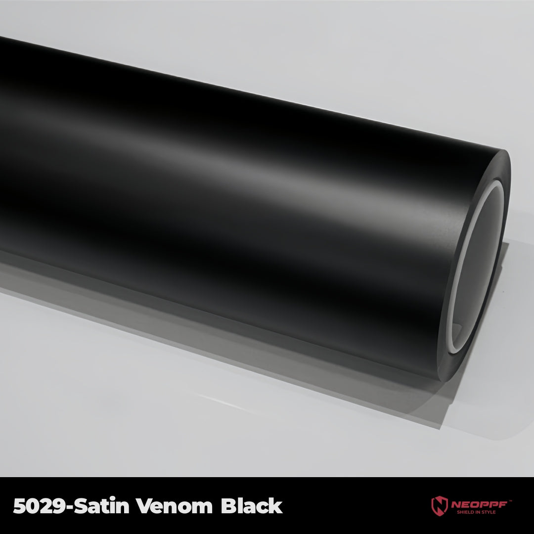 A sports car with Satin Venom Black paint protection film colored wrap is parking in the garage