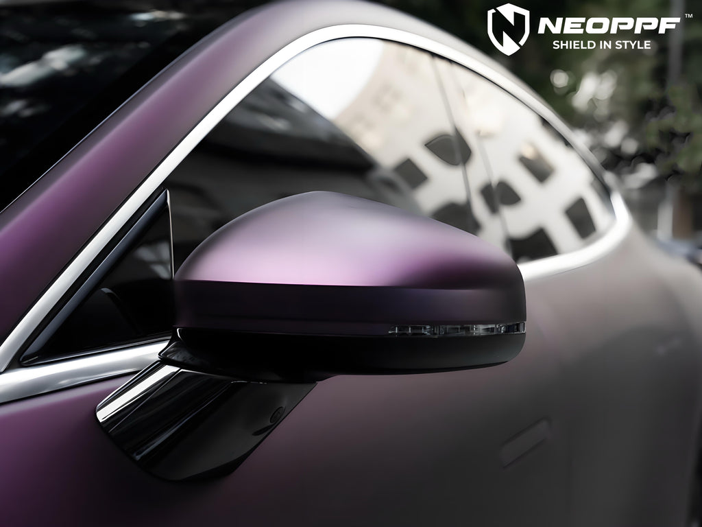 A sports car with Satin Pinot Noir Purple paint protection film colored wrap is parking in the garage