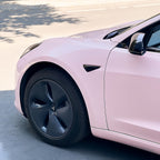 A sports car with Shell Pink paint protection film colored wrap is parking in the garage