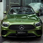 A sports car with Mamba Green paint protection film colored wrap is parking in the garage