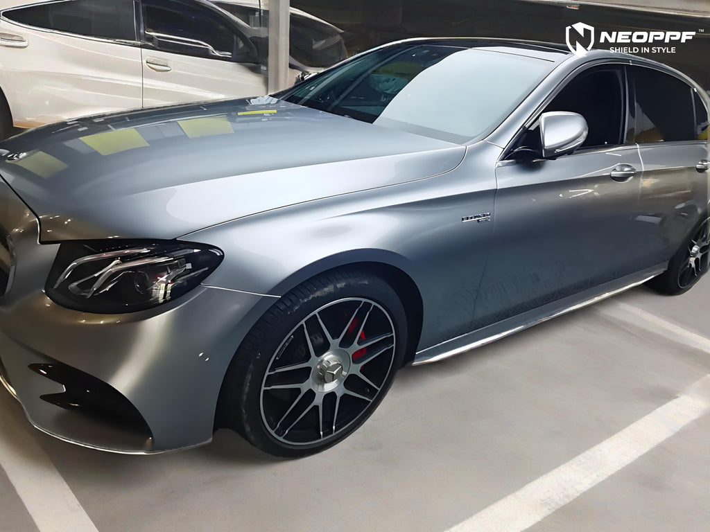 A sports car with Matte Optical Silver Carbon Fiber paint protection film colored wrap is parking in the garage