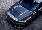 A sports car with Matte Transparent Carbon Fiber paint protection film colored wrap is parking in the garage