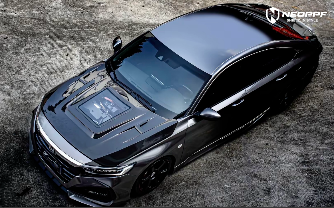 A sports car with Matte Transparent Carbon Fiber paint protection film colored wrap is parking in the garage