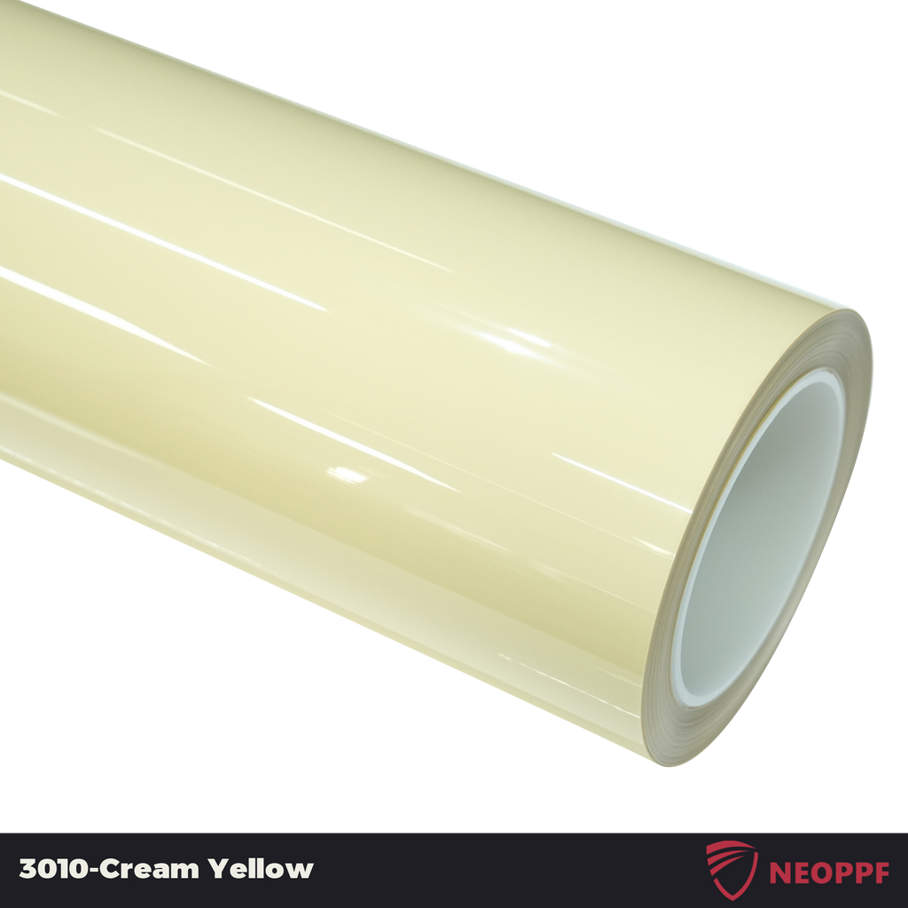 A sports car with Cream Yellow paint protection film colored wrap is parking in the garage