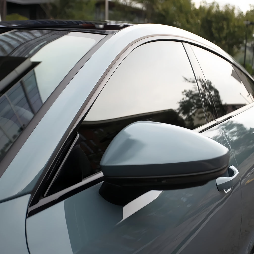 A sports car with Eucalyptus Blue paint protection film colored wrap is parking in the garage