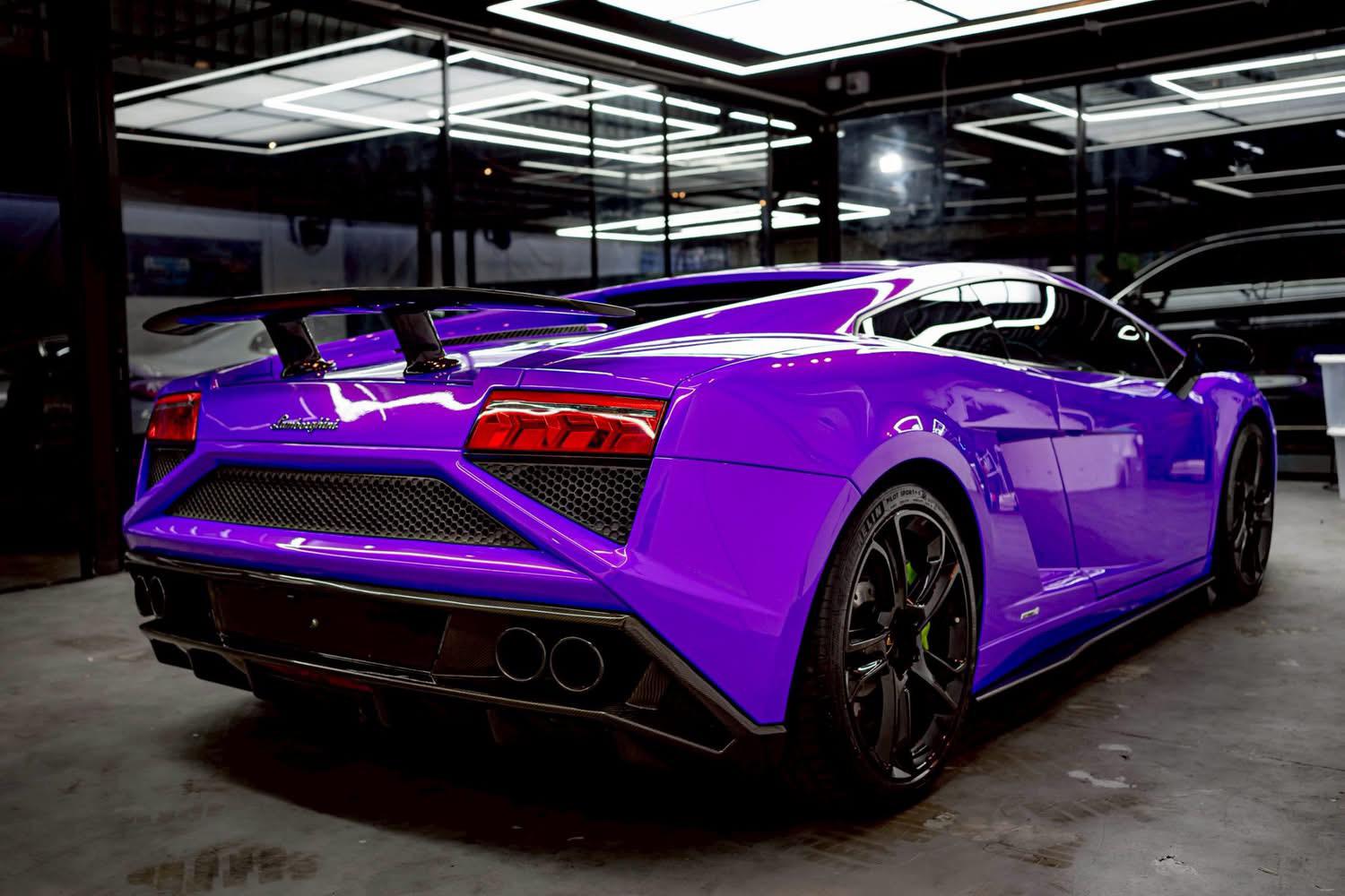 Purple sports car in a showroom setting