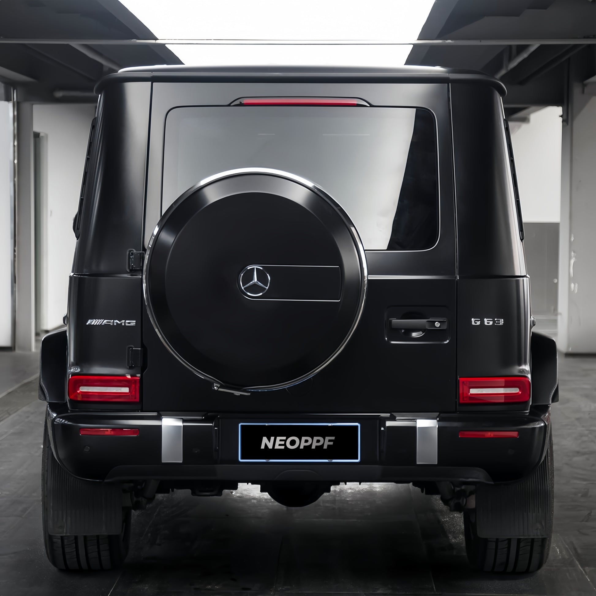 A sports car with Satin Venom Black paint protection film colored wrap is parking in the garage