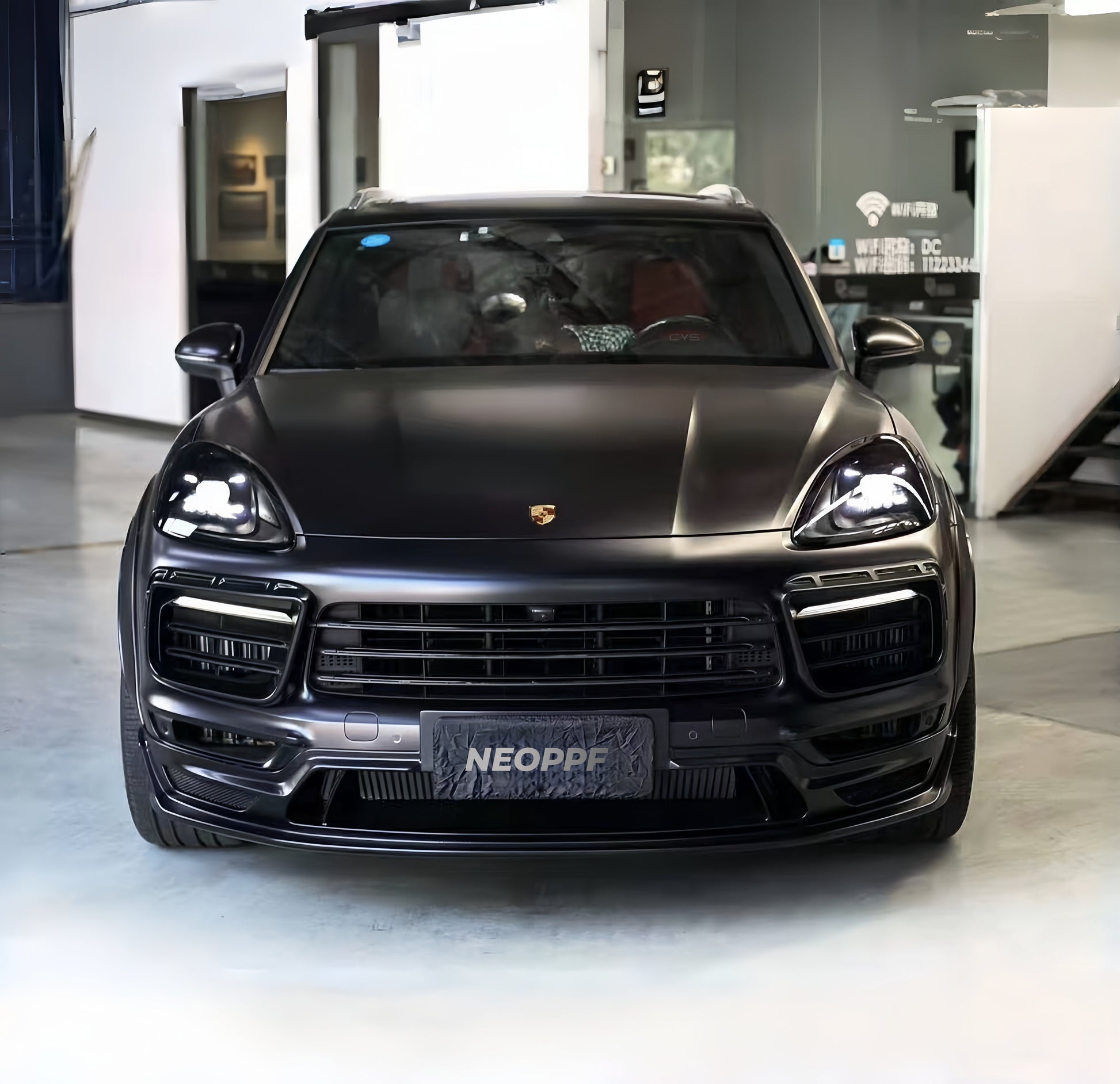 A sports car with Super Matte Black paint protection film colored wrap is parking in the garage