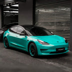 A sports car with Turquoise Blue paint protection film colored wrap is parking in the garage