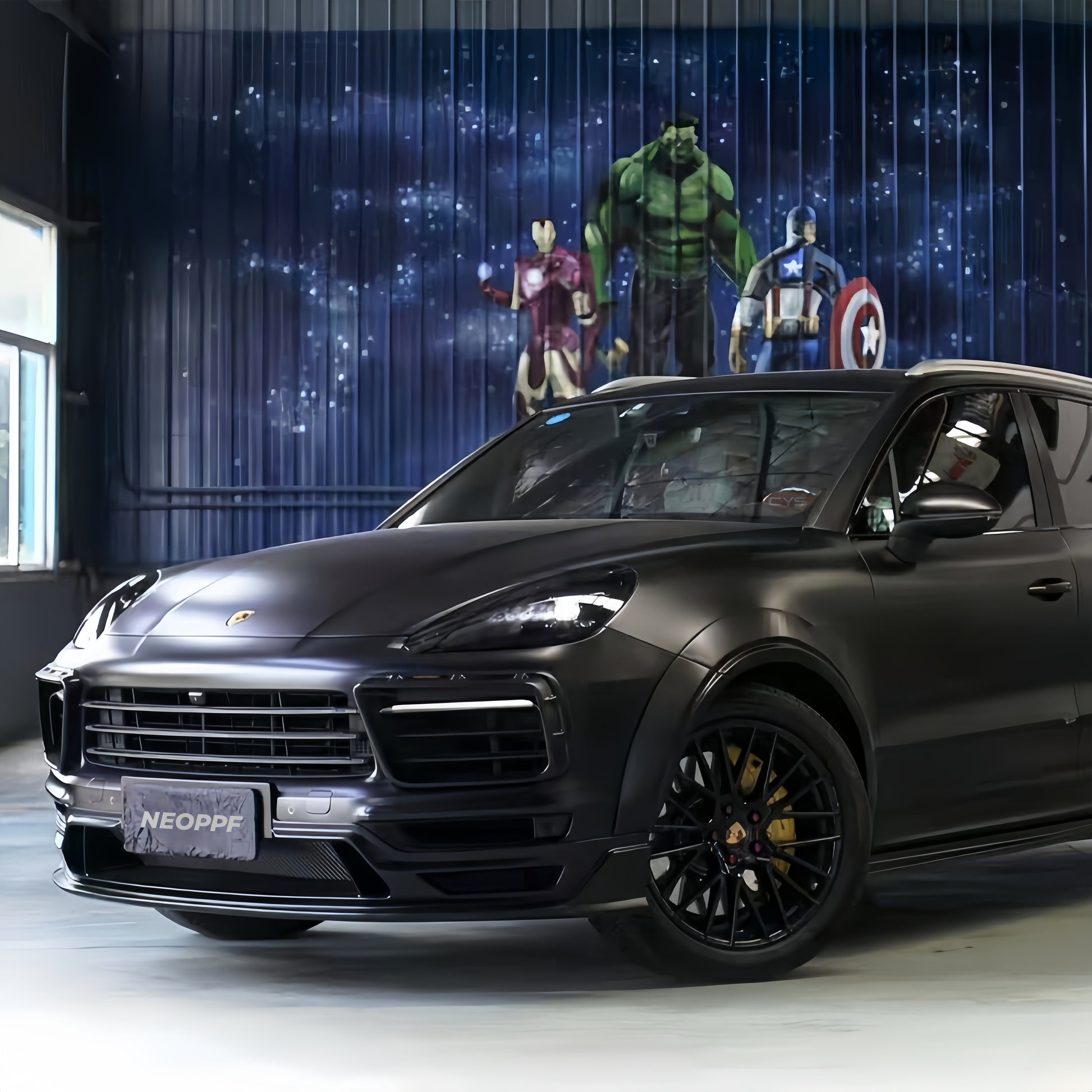 A sports car with Super Matte Black paint protection film colored wrap is parking in the garage